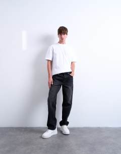 Model wearing 3 pack relaxed fit t-shirt in white, chocolate and stone 