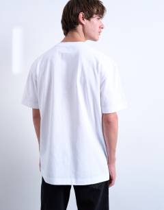 Model wearing 3 pack relaxed fit t-shirt in white, chocolate and stone 