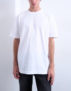 Model wearing 3 pack relaxed fit t-shirt in white, chocolate and stone 