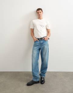 Model wearing 5 pack classic fit t-shirt in black, charcoal, ecru, khaki and burgundy