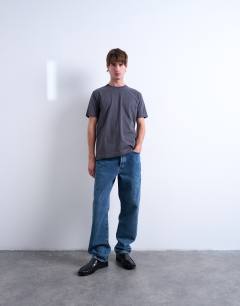 Model wearing 5 pack classic fit t-shirt in black, white, charcoal, chocolate and stone 