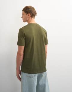 Model wearing 5 pack classic fit t-shirt in black, white, stone, navy and khaki