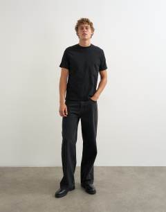 Model wearing 5 pack classic fit t-shirt in navy, ecru, brown, stone and black