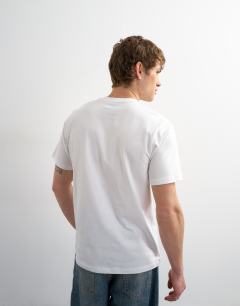 Model wearing 5 pack classic fit t-shirt in navy, ecru, pink, brown and blue
