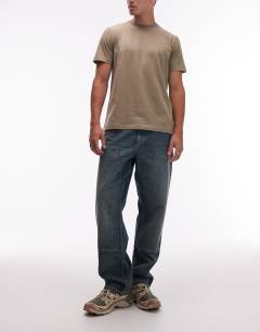 Model wearing 5 pack classic fit t-shirt in white, ecru, khaki, charcoal and black