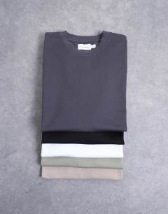 Model wearing 5 pack relaxed fit t-shirt in black, white, beige, sage and charcoal 