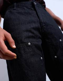 Model wearing Baggy carpenter jean in raw black