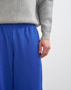 Model wearing Baggy fit airtex jogger in cobalt