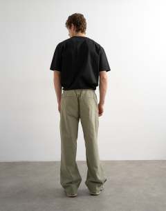 Model wearing Baggy fit canvas cargo trouser in khaki