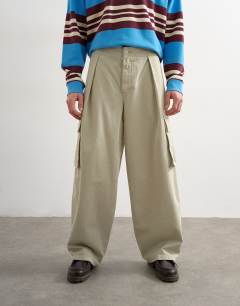 Model wearing Baggy fit cargo trouser in stone
