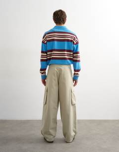 Model wearing Baggy fit cargo trouser in stone