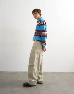 Model wearing Baggy fit cargo trouser in stone