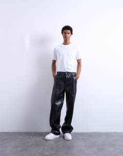 Model wearing Baggy fit faux leather trouser in black