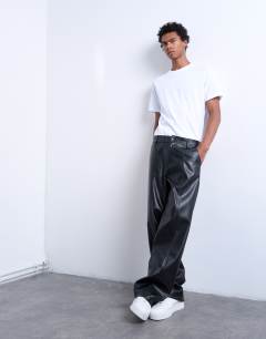 Model wearing Baggy fit faux leather trouser in black