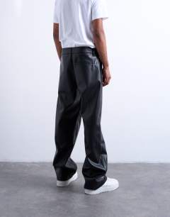 Model wearing Baggy fit faux leather trouser in black