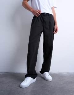 Model wearing Baggy fit high waisted twill trouser in black