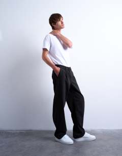 Model wearing Baggy fit high waisted twill trouser in black
