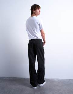 Model wearing Baggy fit high waisted twill trouser in black