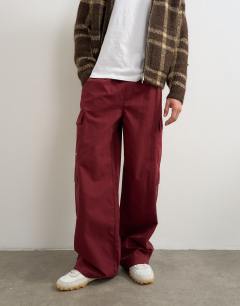 Model wearing Baggy fit nylon ripstop cargos in burnt red