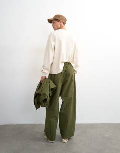 Model wearing Baggy fit nylon ripstop trouser in green
