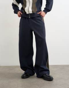 Model wearing Baggy fit paneled pique jogger in navy