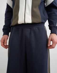 Model wearing Baggy fit paneled pique jogger in navy