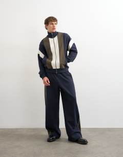 Model wearing Baggy fit panelled pique jogger in navy