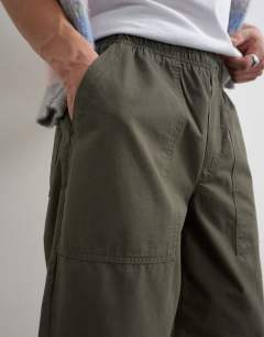 Model wearing Baggy fit ripstop trouser in khaki