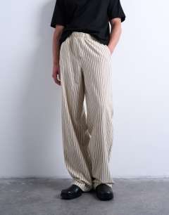 Model wearing Baggy fit stripe trouser in ecru