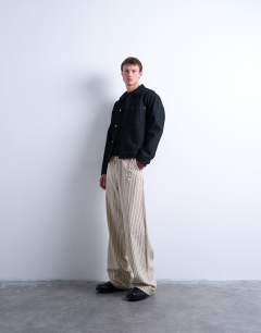Model wearing Baggy fit stripe trouser in ecru