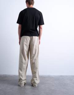Model wearing Baggy fit stripe trouser in ecru