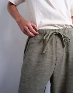 Model wearing Baggy fit texture trouser in khaki