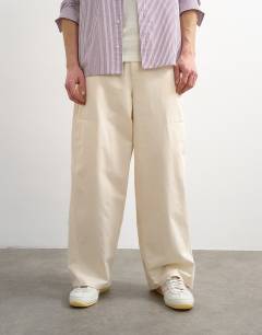 Model wearing Baggy fit trousers with side pockets in cream