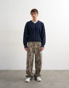 Model wearing Baggy fit twill cargo in camo print