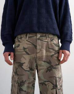 Model wearing Baggy fit twill cargo in camo print