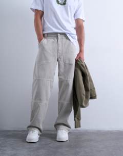 Model wearing Baggy fit twill chino with leg panels in stone