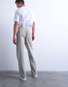 Model wearing Baggy fit twill chino with leg panels in stone
