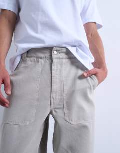 Model wearing Baggy fit twill chino with leg panels in stone