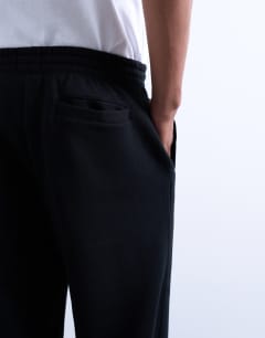 Model wearing Baggy leg jogger in black