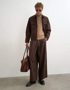 Model wearing Balloon fit herringbone twill trouser in brown