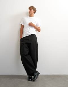 Model wearing Barrel fit trouser in black