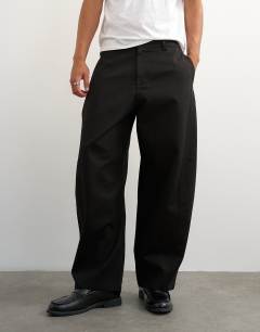 Model wearing Barrel fit trouser in black