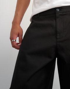Model wearing Barrel fit trouser in black