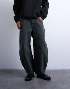 Model wearing Barrel jean in green