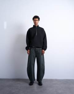 Model wearing Barrel jean in green