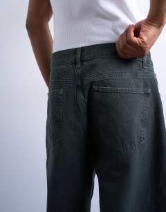 Model wearing Barrel jean in green