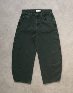 Model wearing Barrel jean in green