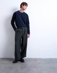 Model wearing Barrel trousers in herringbone warm handle in grey