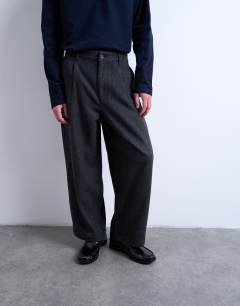 Model wearing Barrel trousers in herringbone warm handle in grey