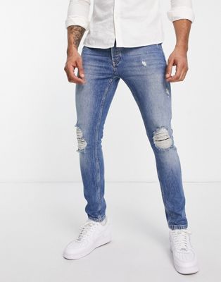 Topman blowout stretch skinny jeans in mid wash